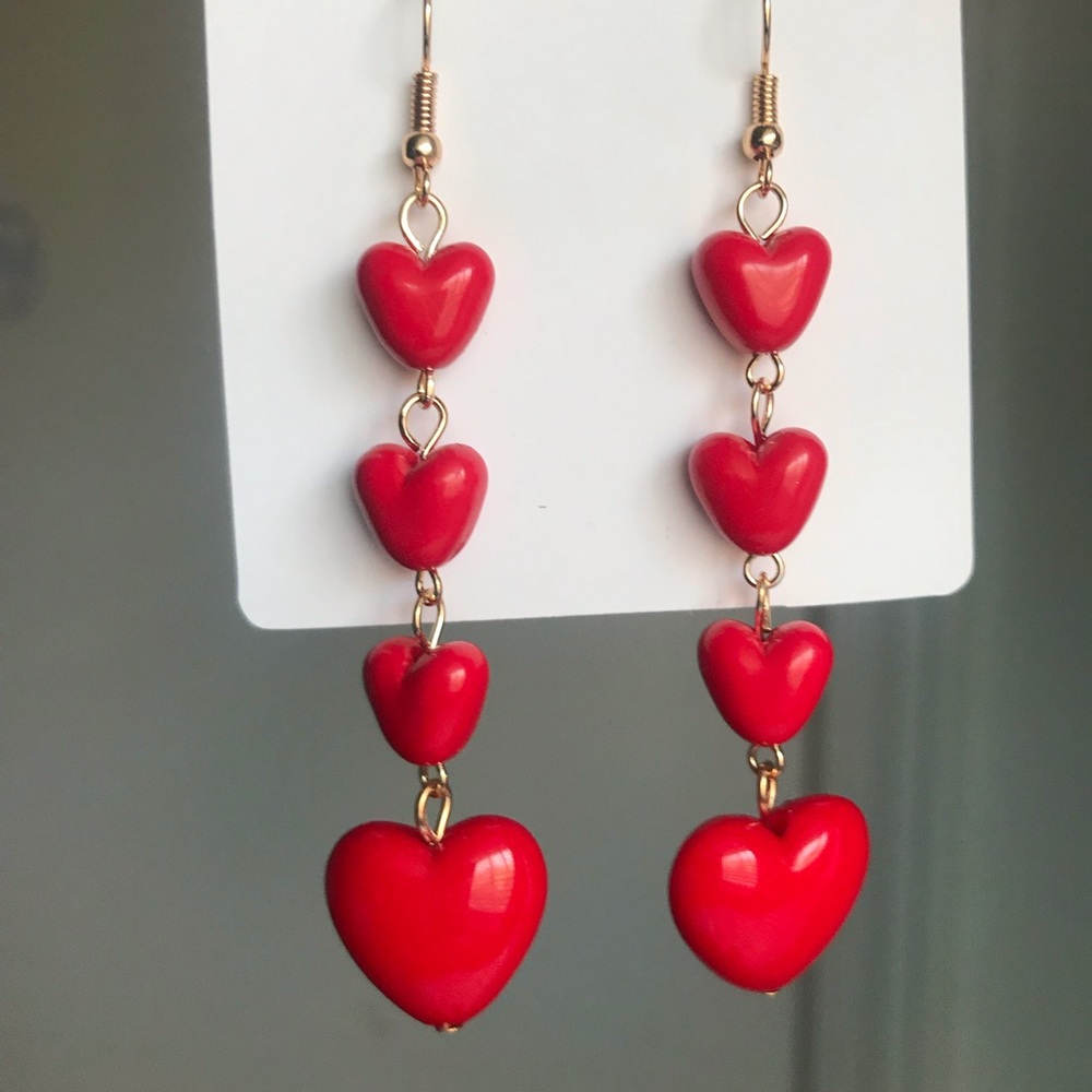 red heart shaped gold dangle earrings